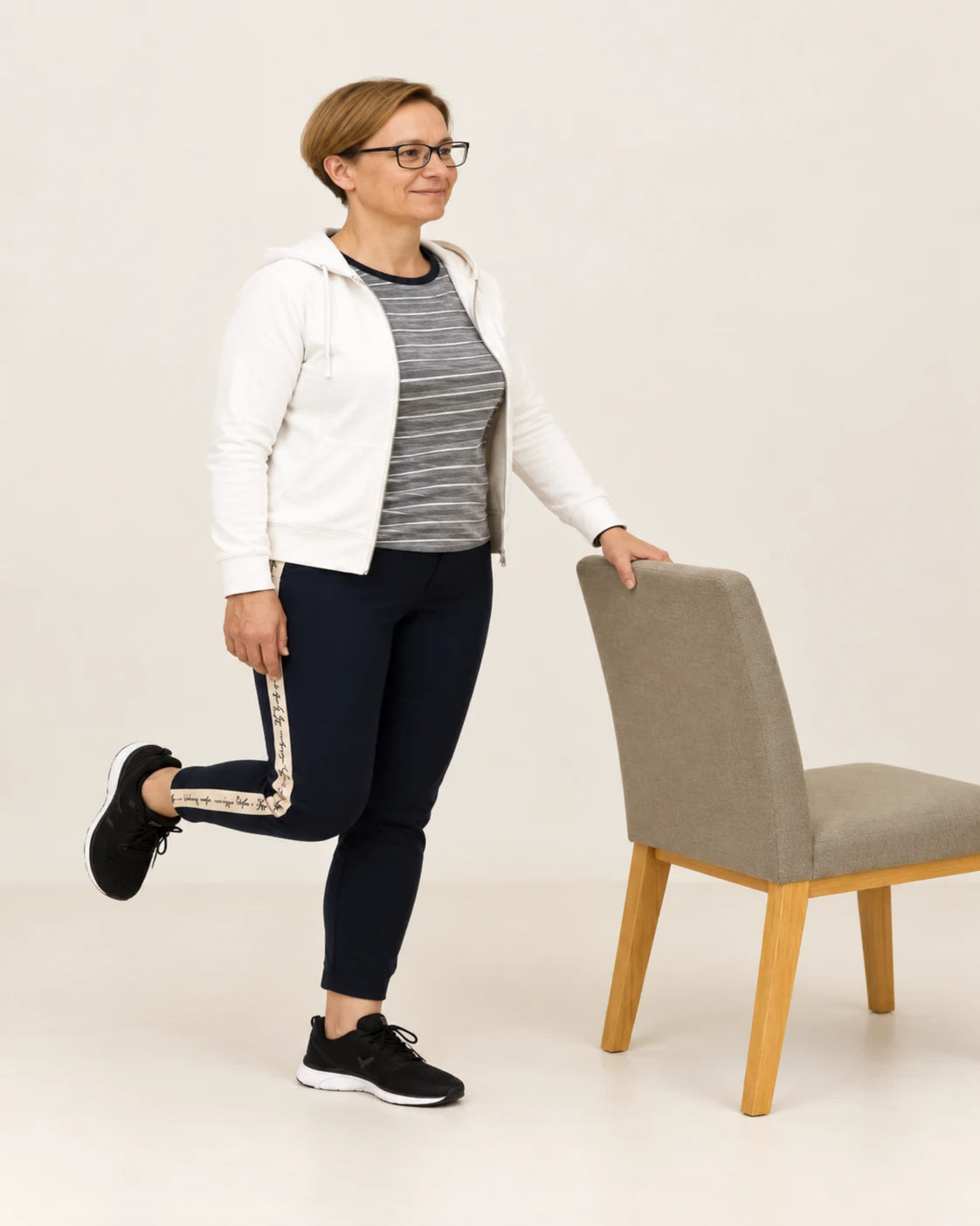 Supported single-leg balance: lift one foot.